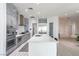 Modern kitchen with stainless steel appliances, quartz countertops, and a center island at 271 E Shelbourne Ave, Las Vegas, NV 89123