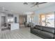 Open floor plan featuring tile floors, a modern kitchen island, and a comfortable seating area at 271 E Shelbourne Ave, Las Vegas, NV 89123