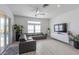 Well-lit living room showcases modern decor, an entertainment center, and access to the pool at 271 E Shelbourne Ave, Las Vegas, NV 89123