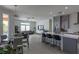 Open-concept living area features tile flooring, stylish lighting, and access to the pool at 271 E Shelbourne Ave, Las Vegas, NV 89123