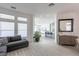 Spacious living area with tile flooring, recessed lighting, and a view of the kitchen at 271 E Shelbourne Ave, Las Vegas, NV 89123