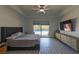 Beautiful bedroom with sliding glass door to the pool area, ceiling fan, and elegant dresser for ample storage space at 271 E Shelbourne Ave, Las Vegas, NV 89123