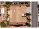 Drone shot of a home showing the roof, the backyard with desert landscaping, and a concrete patio set at 2752 Fort Myer Ave, Henderson, NV 89052