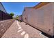 Low maintenance backyard featuring gravel and stepping stones between house and fence at 2752 Fort Myer Ave, Henderson, NV 89052