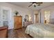 Bedroom with hardwood floors, large windows, and a comfortable bed at 2752 Fort Myer Ave, Henderson, NV 89052