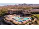 Aerial shot of the Sun City Anthem community pool with mountain views in the background at 2752 Fort Myer Ave, Henderson, NV 89052