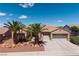 Charming single-story home with a three-car garage and desert landscaping, including palm trees at 2752 Fort Myer Ave, Henderson, NV 89052