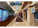 Bright interior hallway featuring high ceilings and signs for various community amenities at 2752 Fort Myer Ave, Henderson, NV 89052