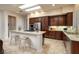 Modern kitchen features an island, stainless steel appliances, granite countertops, and plenty of cabinet space at 2752 Fort Myer Ave, Henderson, NV 89052