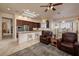 Open living area with tile floors, ample lighting, and seamless access to the dining area and kitchen at 2752 Fort Myer Ave, Henderson, NV 89052