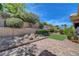 Landscaped backyard offers a serene retreat with artificial turf and patio perfect for outdoor enjoyment at 2805 Hanging Rock Dr, Las Vegas, NV 89134