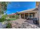 Beautiful backyard with lush landscaping, artificial turf, and a brick patio for relaxation and enjoyment at 2805 Hanging Rock Dr, Las Vegas, NV 89134