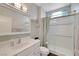 Bathroom featuring a sink, toilet, mirror, and shower behind a glass door at 2805 Hanging Rock Dr, Las Vegas, NV 89134