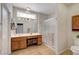 Bathroom featuring a sink, mirror, shower, and toilet; good lighting at 2805 Hanging Rock Dr, Las Vegas, NV 89134