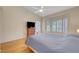 Bedroom featuring wood floors, a ceiling fan, and white walls at 2805 Hanging Rock Dr, Las Vegas, NV 89134