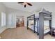 Bedroom features tile flooring and is open to the kitchen with french doors at 2805 Hanging Rock Dr, Las Vegas, NV 89134