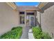 Charming home with a decorative front door, sidelight windows, and manicured hedges at 2805 Hanging Rock Dr, Las Vegas, NV 89134