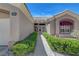 Inviting front entrance with decorative door, window, and manicured hedges leading to the front door at 2805 Hanging Rock Dr, Las Vegas, NV 89134