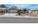 Charming single-story home with a two-car garage, desert landscaping, and a welcoming entrance at 2805 Hanging Rock Dr, Las Vegas, NV 89134