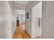 Hallway featuring wood floors leading to another room, including a towel and switch at 2805 Hanging Rock Dr, Las Vegas, NV 89134