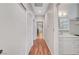 Hallway featuring wood floors with a closet and bathroom located to the right at 2805 Hanging Rock Dr, Las Vegas, NV 89134