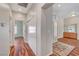 Hallway featuring wood-look floors leading to other rooms of the home with a storage closet at 2805 Hanging Rock Dr, Las Vegas, NV 89134