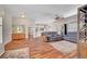Open-concept living room with hardwood floors, comfortable seating, and seamless flow to other living spaces at 2805 Hanging Rock Dr, Las Vegas, NV 89134