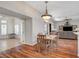 Open concept living room featuring wood-look floors and leading to a carpeted living room area at 2805 Hanging Rock Dr, Las Vegas, NV 89134