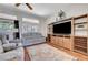 Relaxing living room features hardwood floors, large TV, media center and comfortable seating at 2805 Hanging Rock Dr, Las Vegas, NV 89134