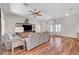 Bright living room with hardwood floors, neutral walls, large windows, and comfortable seating at 2805 Hanging Rock Dr, Las Vegas, NV 89134