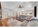 Open-concept living area features hardwood floors, backyard access, and a view of the entryway and dining room at 2805 Hanging Rock Dr, Las Vegas, NV 89134