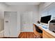 Office with a desk, a full size refrigerator, and wood-look flooring at 2805 Hanging Rock Dr, Las Vegas, NV 89134