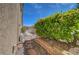 Side yard featuring gravel bed with pavers, perfect for low-maintenance outdoor living and landscaping at 2805 Hanging Rock Dr, Las Vegas, NV 89134