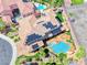 Stunning aerial view of a custom home with a private pool, solar panels, and desert landscaping at 2820 Sisteron Ct, Henderson, NV 89044