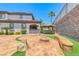 Expansive backyard featuring a pool view, a firepit with seating, covered patio and well-manicured landscaping at 2820 Sisteron Ct, Henderson, NV 89044