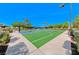 Full basketball court featuring a green playing surface, pristine white lines, and a vibrant blue key area at 2820 Sisteron Ct, Henderson, NV 89044