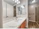 Bathroom features a shower with glass door and wood cabinets with a light countertop at 2820 Sisteron Ct, Henderson, NV 89044