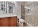 Modern bathroom featuring a glass shower, a vanity with marble countertop, and vinyl flooring at 2820 Sisteron Ct, Henderson, NV 89044
