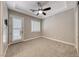 Bedroom featuring a ceiling fan, neutral carpet, and walk out entry to patio at 2820 Sisteron Ct, Henderson, NV 89044