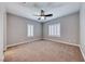 Neutral bedroom features a ceiling fan and windows with plantation shutters at 2820 Sisteron Ct, Henderson, NV 89044