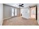 Neutral bedroom features a ceiling fan and access to an outdoor balcony at 2820 Sisteron Ct, Henderson, NV 89044