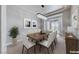Dining room with a modern chandelier and sliding glass doors at 2820 Sisteron Ct, Henderson, NV 89044