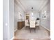 Elegant dining room with tray ceilings, stylish light fixture, and neutral decor at 2820 Sisteron Ct, Henderson, NV 89044