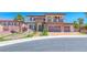 Stunning two-story home with a stone facade, three-car garage, and meticulously landscaped front yard at 2820 Sisteron Ct, Henderson, NV 89044