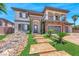 Elegant two-story home with stone accents, a three-car garage, and manicured landscaping at 2820 Sisteron Ct, Henderson, NV 89044