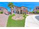 Beautifully landscaped front yard with a rock feature and lush green lawn leading to the inviting home at 2820 Sisteron Ct, Henderson, NV 89044