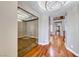 Bright and open hallway with hardwood floors and a view of the staircase and upstairs landing at 2820 Sisteron Ct, Henderson, NV 89044
