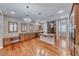 Open-concept kitchen with stainless steel appliances, kitchen island, and breakfast bar at 2820 Sisteron Ct, Henderson, NV 89044