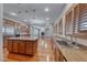 Gourmet kitchen flows into the living room and boasts a large island and hardwood flooring at 2820 Sisteron Ct, Henderson, NV 89044