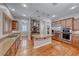 Spacious kitchen features wood floors, stainless appliances, granite countertops and a large island at 2820 Sisteron Ct, Henderson, NV 89044